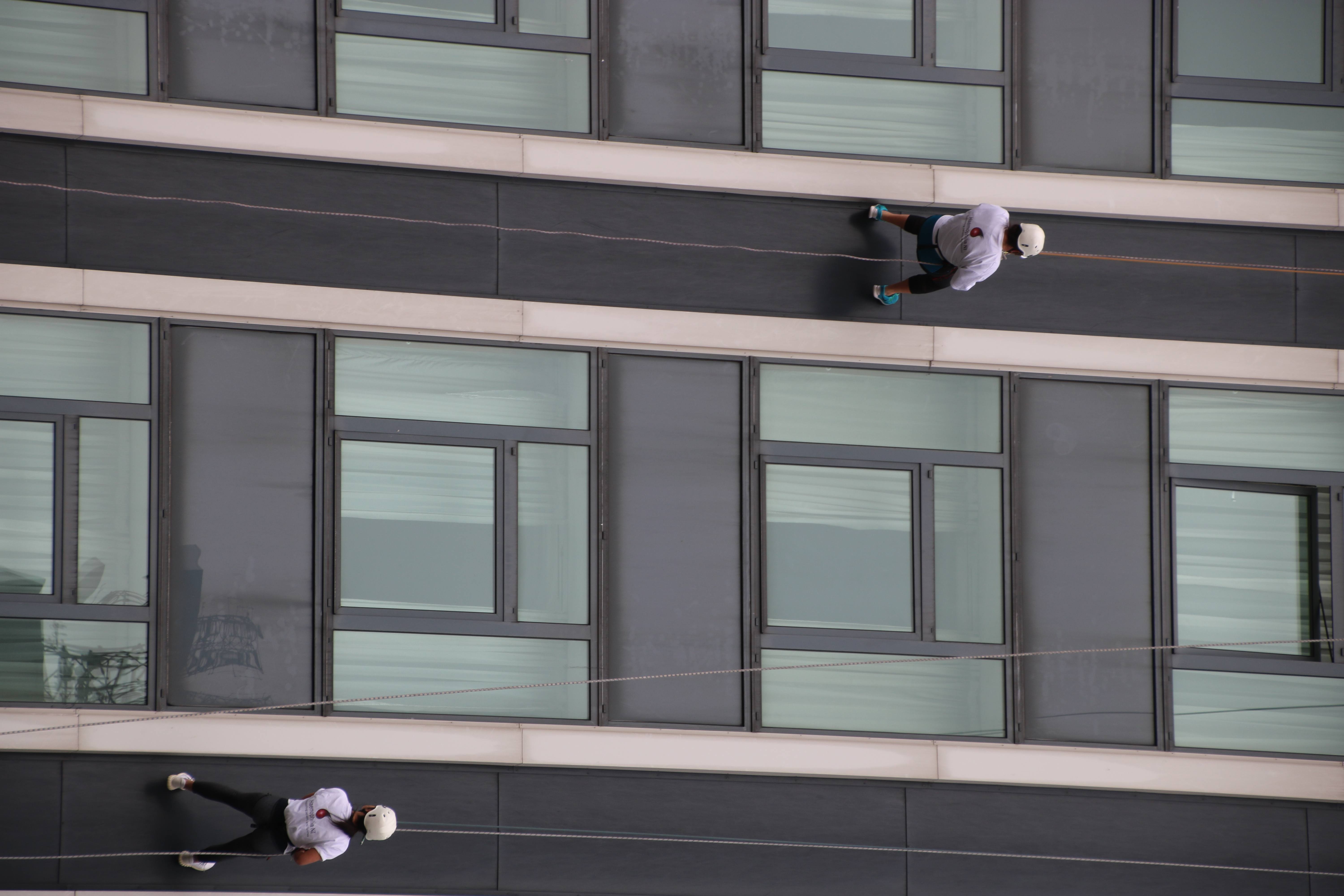 Jill and Sarah abseiling down the Europa Hotel.